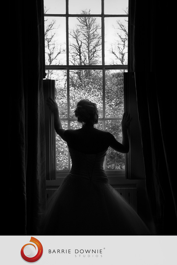 bride-at-hedingham-castle-window Hedingham Castle wedding of Gillian & Stuart 1