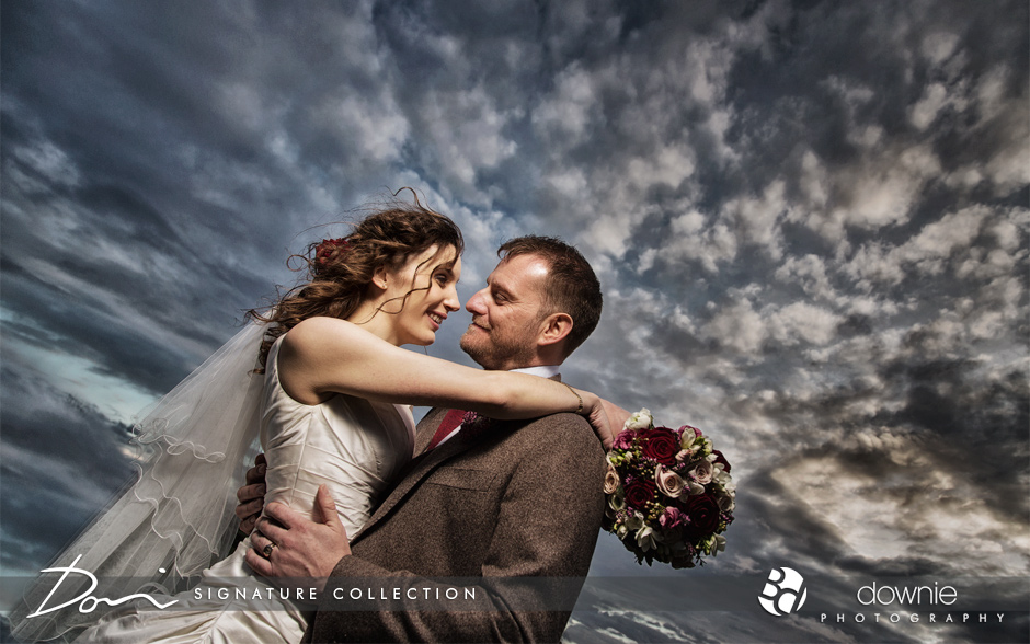 bride and groom dramatic photograph with sky