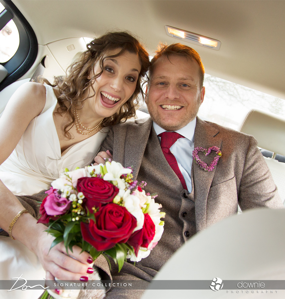 bride-and-groom-laughing-in-car
