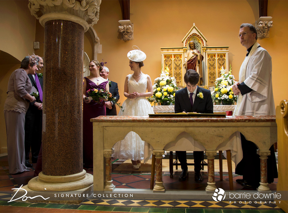 london-wedding-groom-signing-register-in-church