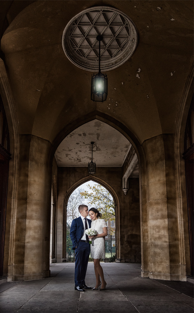Bride and groom photographed on the steps of Chelsea Old Town Hall