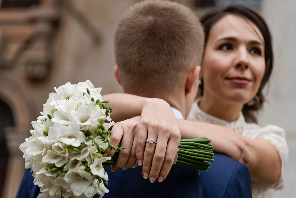 Bride embracing her groom after their Chelsea register office wedding