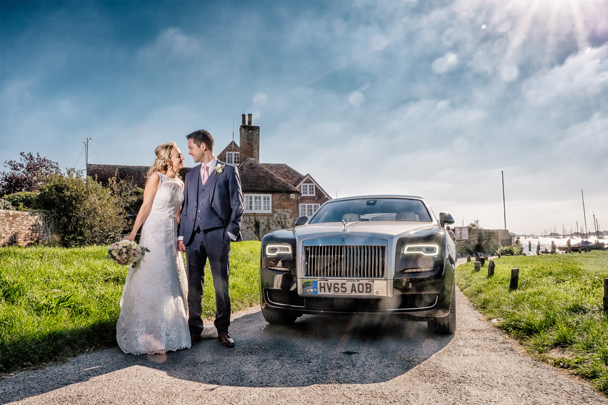 bosham-hoe-church-west-sussex-wedding-bride-and-groom-with-rolls-royce