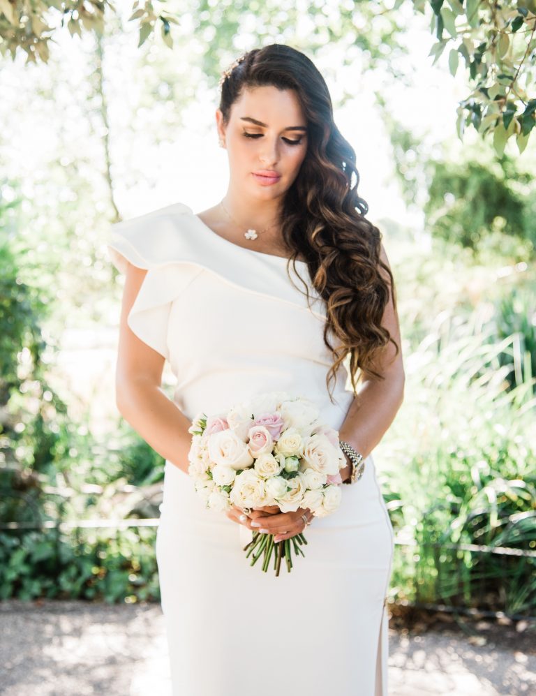 Bride photographed on a London street in a couture gown