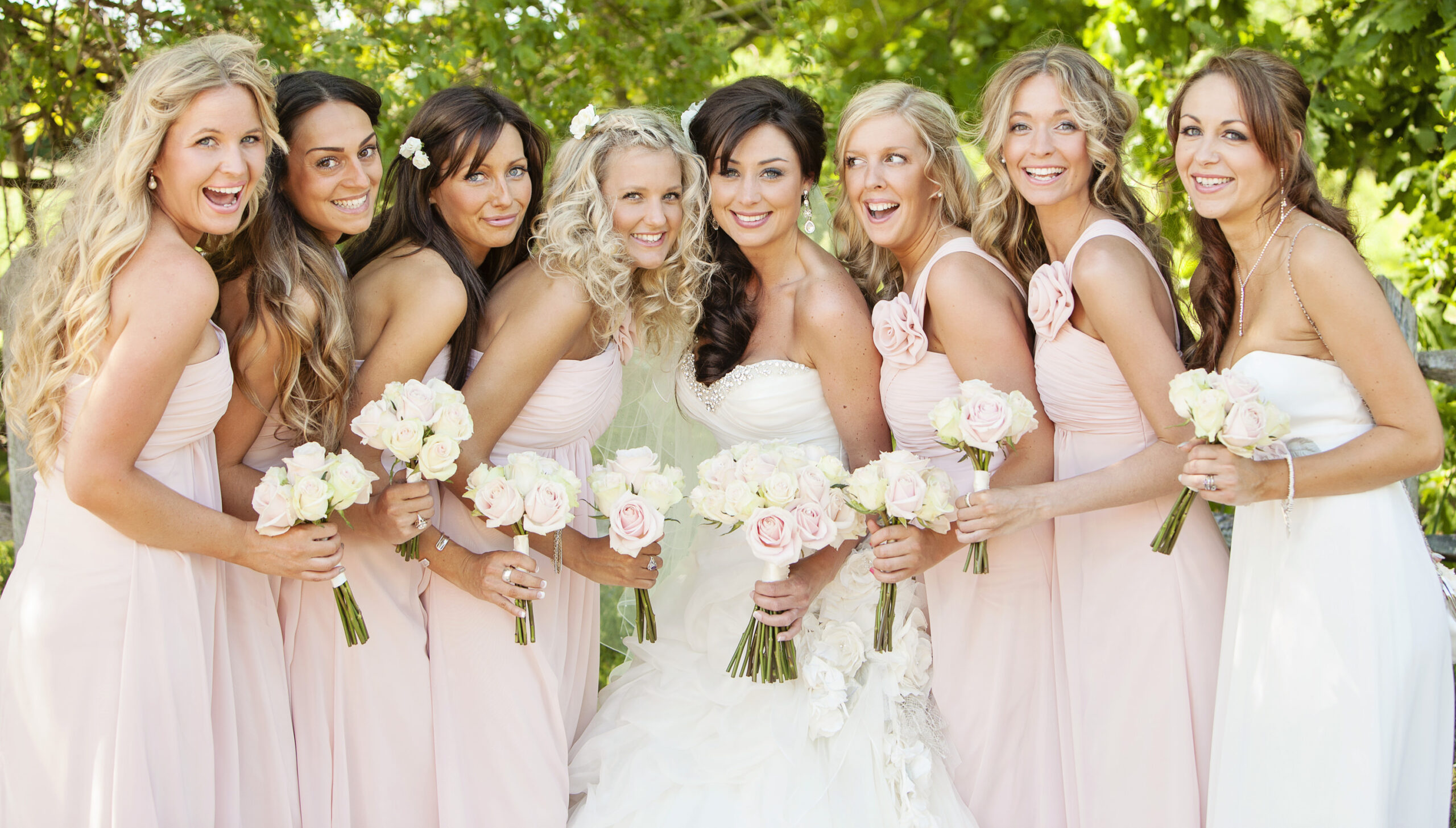 bridesmaids in pastel pink dresses