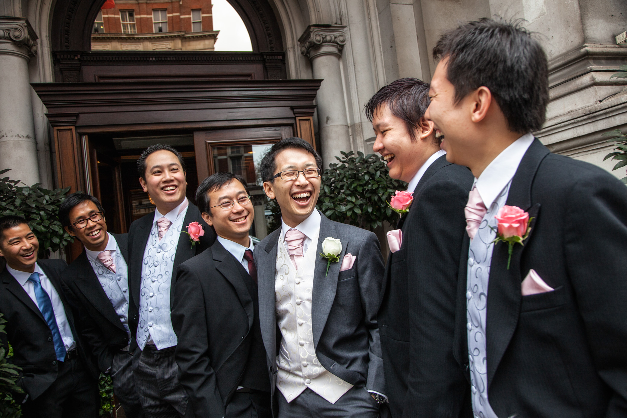 Groom and groomsmen laughing at a Chinese wedding at the Mandarin Oriental Hyde Park
