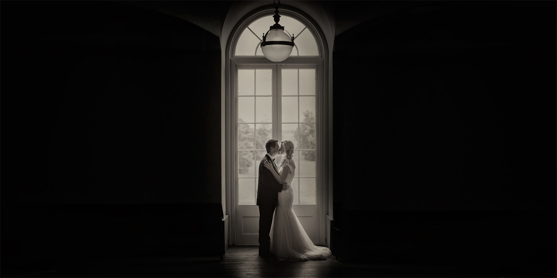 bride kissing the london edition wedding
