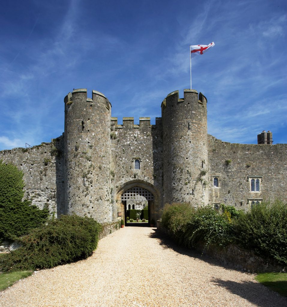 Bride and groom at the gatehouse of Amberley Castle, Sussex