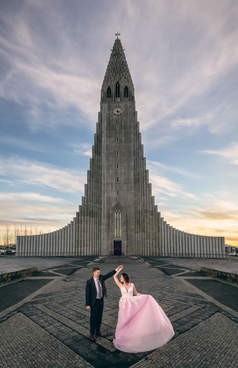Couple in front of Hallgrimskirkja church, Reykjavik