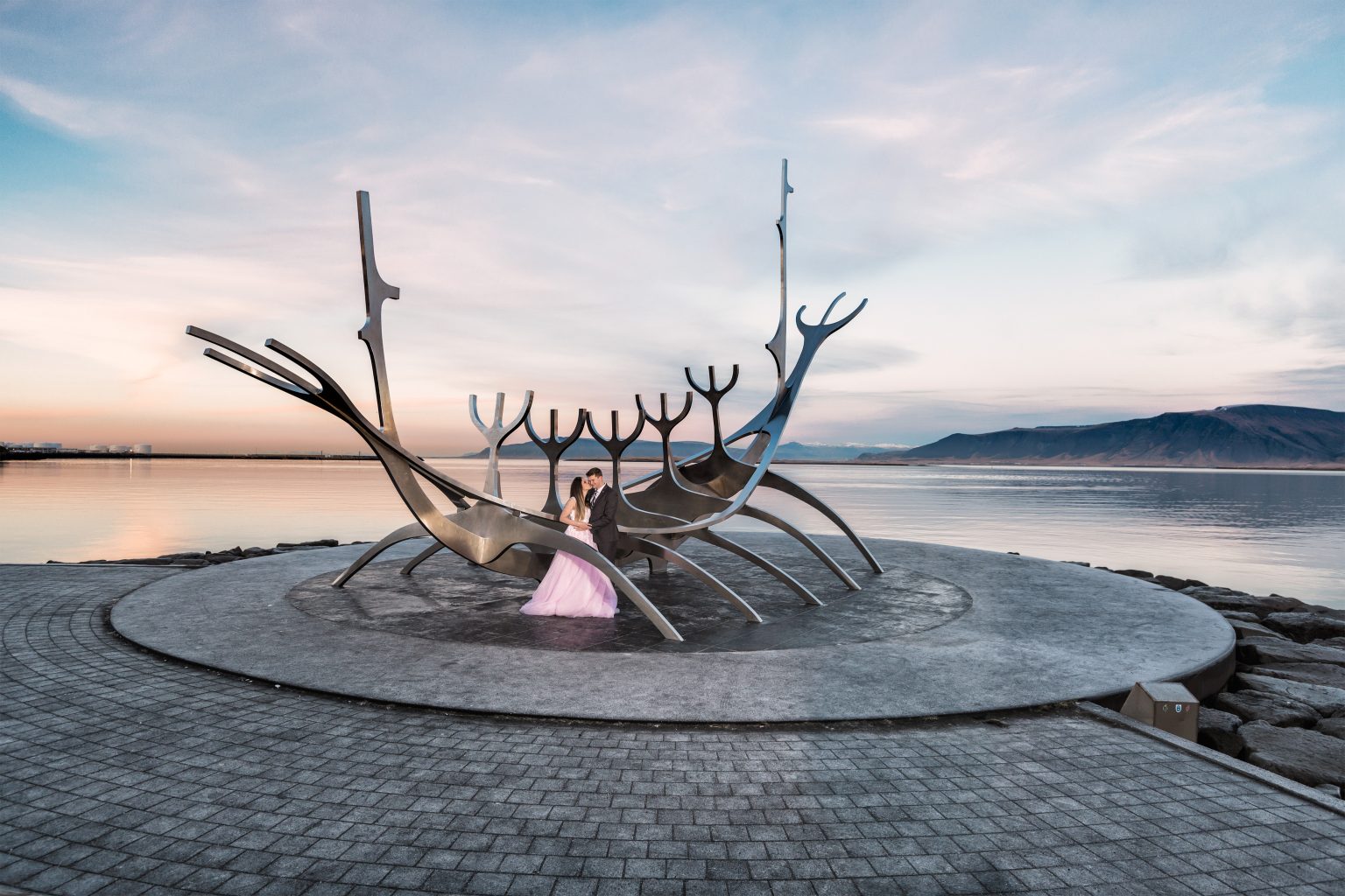 Couple at the Sun Voyager sculpture in Reykjavik