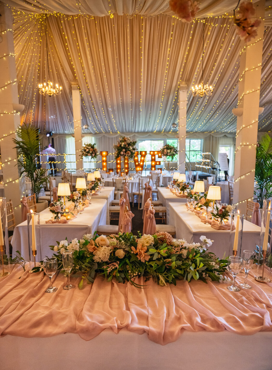Reception barn dressed with flowers at Selden Barns