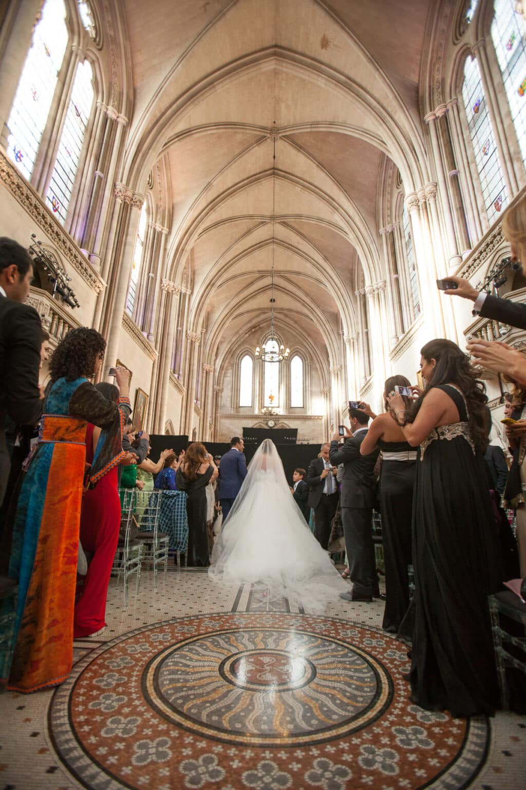 Bride walking down the long aisle at the Royal Courts of Justice