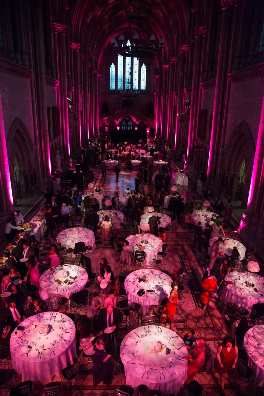 Wedding reception lit in pink at the Royal Courts of Justice