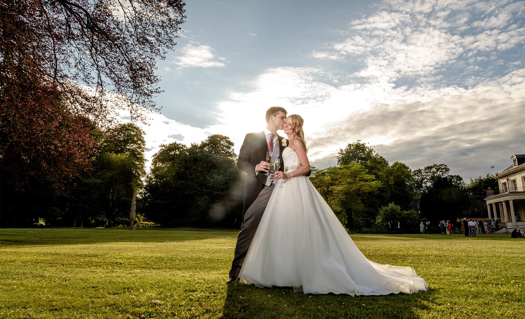 Bride and groom photographed at sunset on their wedding day