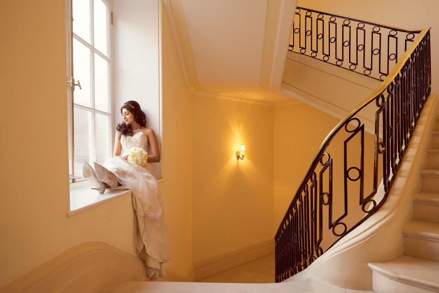 Bride by the staircase at The Ritz London