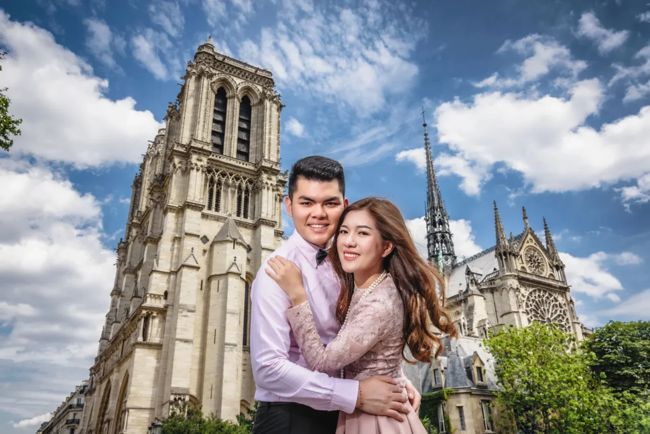 Couple embracing in front of Notre-Dame with its original spire, Paris