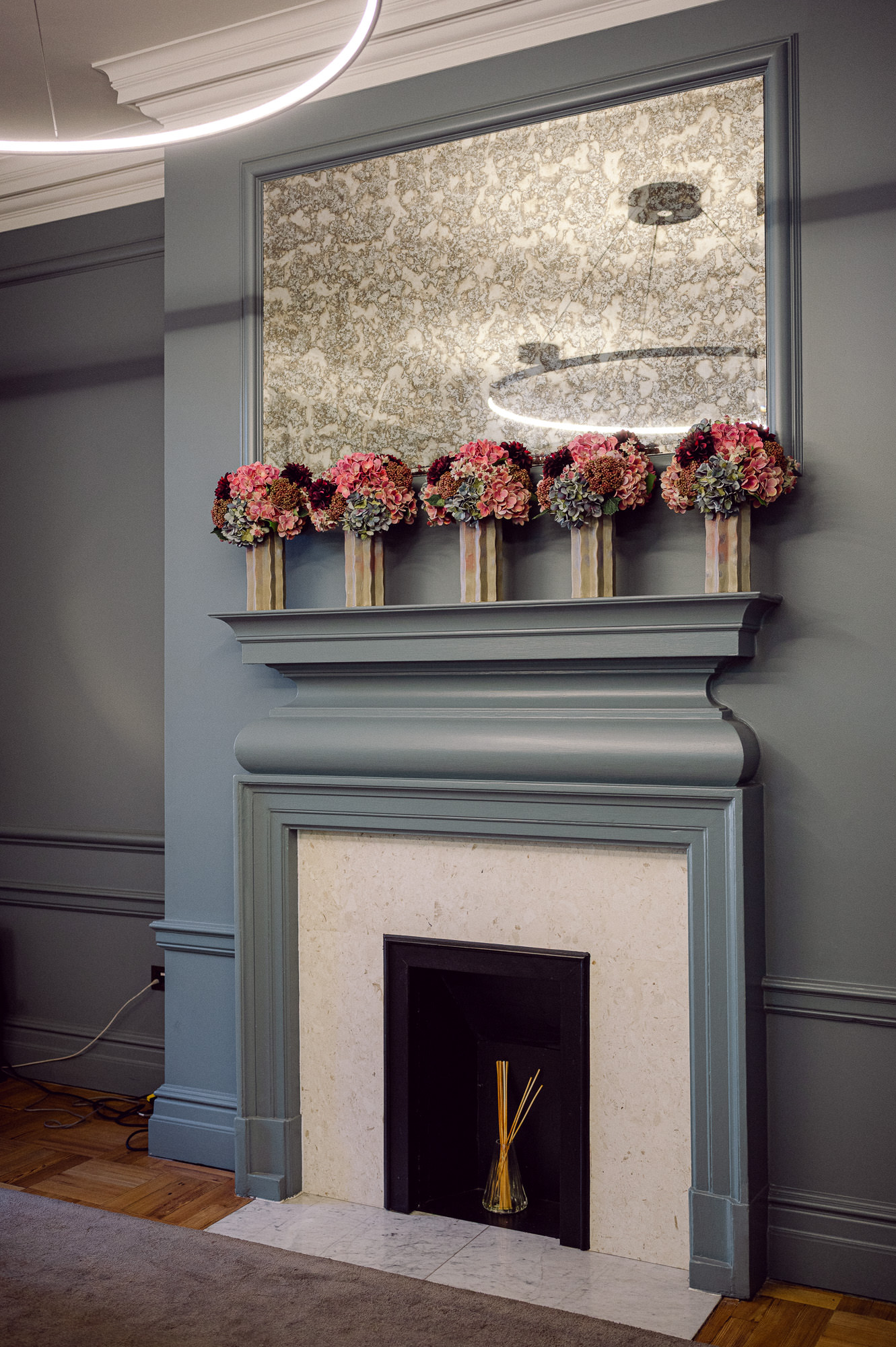 Fireplace and flowers in the Knightsbridge Room at Old Marylebone Town Hall