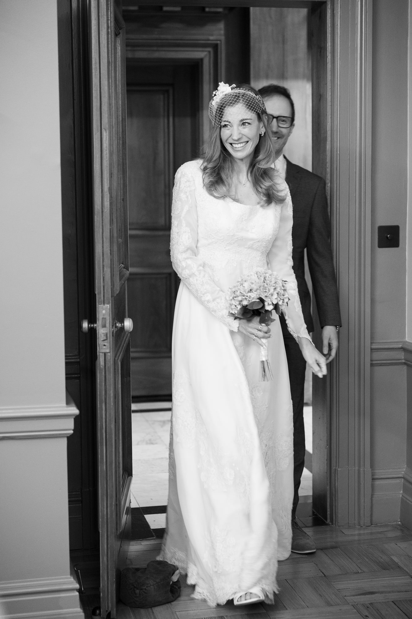 Bride in her mother's 1985 lace dress walking into the Knightsbridge Room