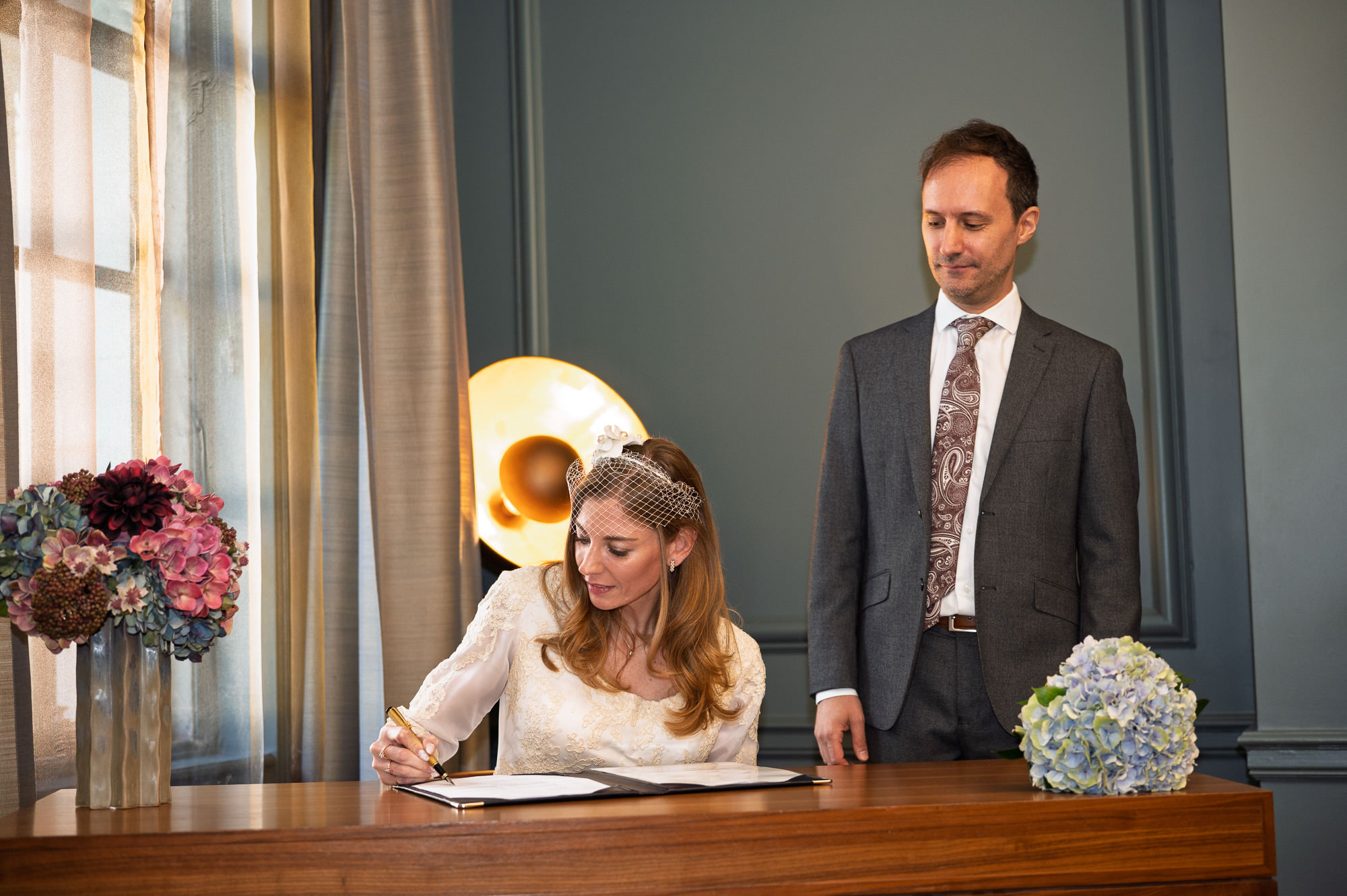 Bride signing the register at Old Marylebone Town Hall