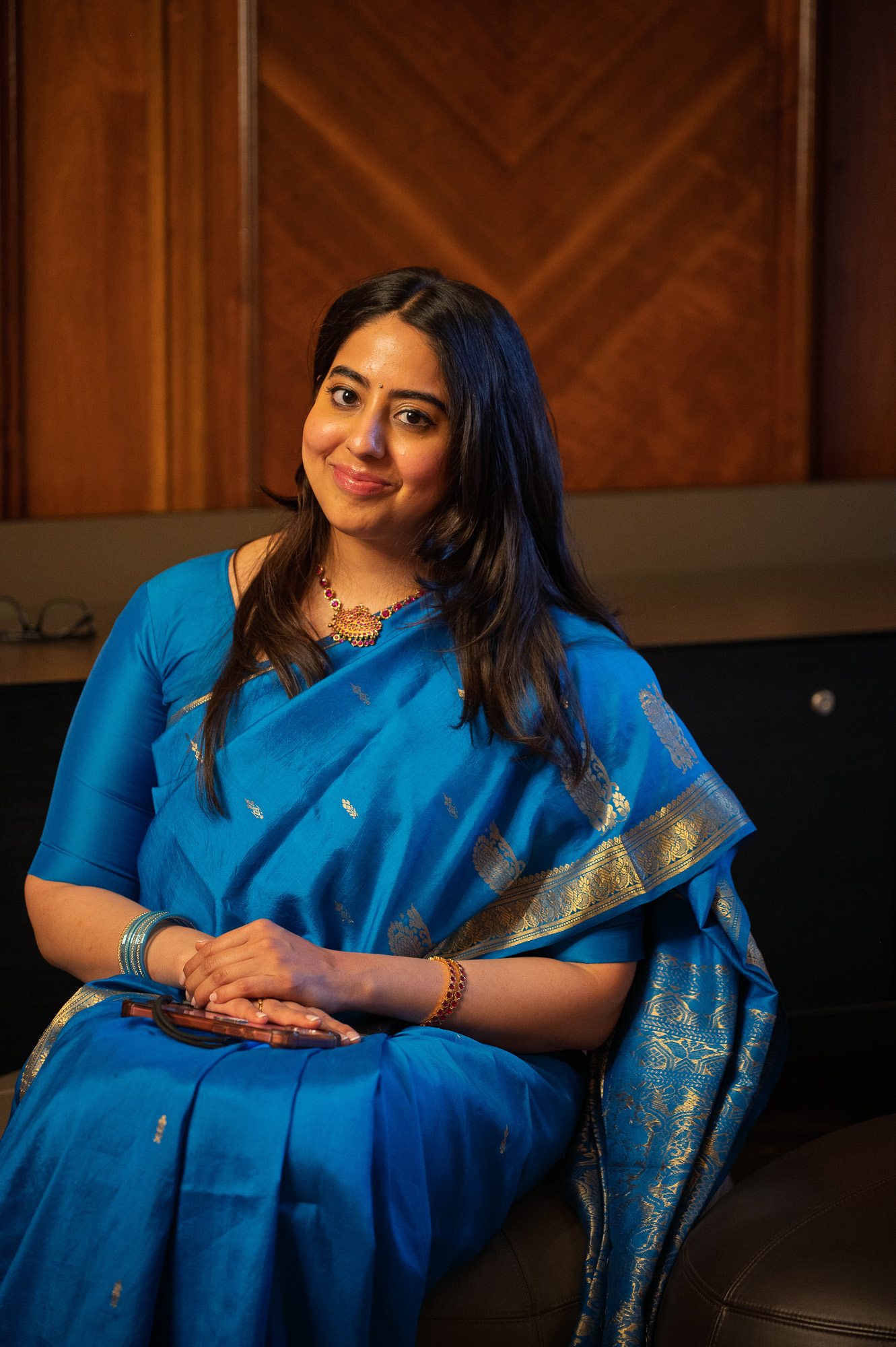Wedding guest in a blue silk sari in the Paddington Room at Old Marylebone Town Hall