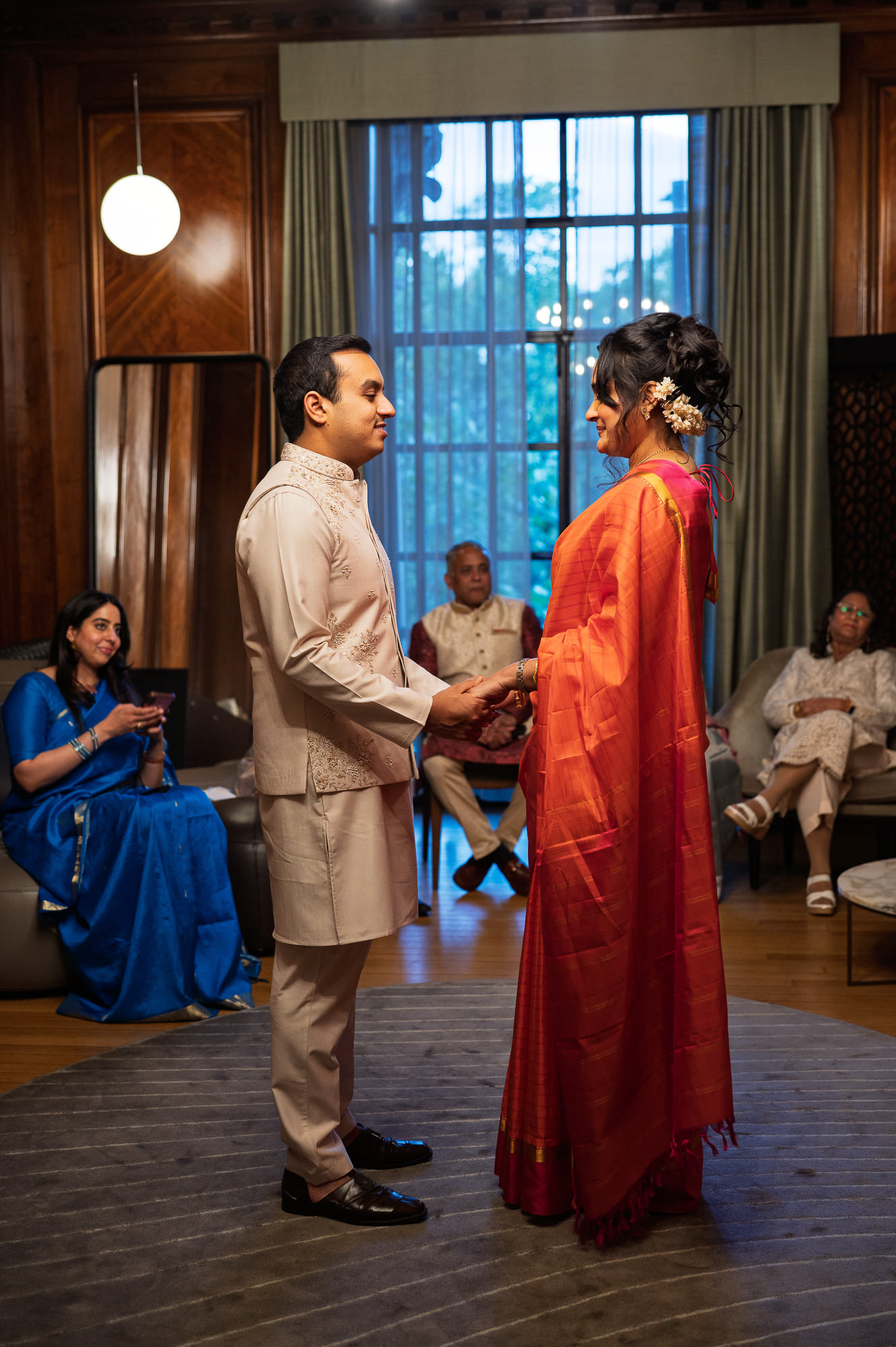 Bride and groom facing each other during the ceremony in the Paddington Room