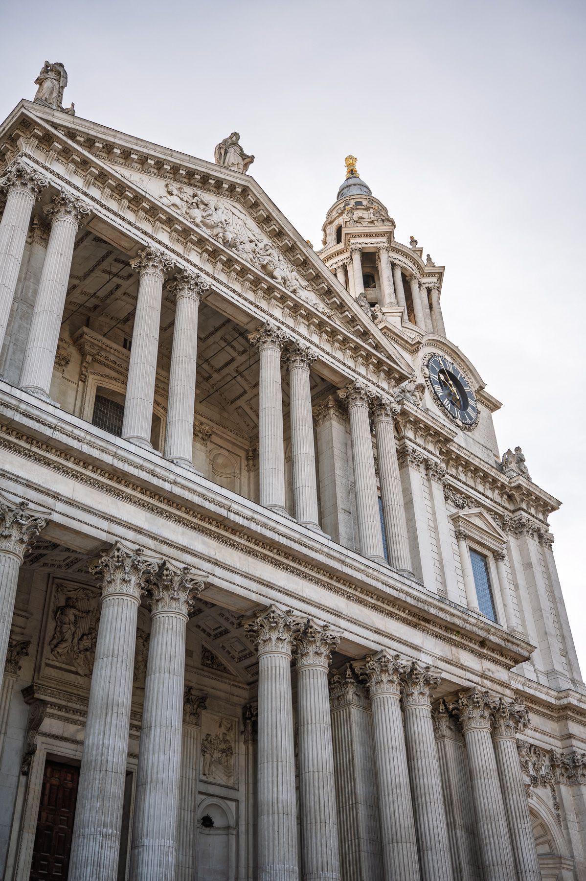Looking up at the west front and clock tower of St Paul's Cathedral