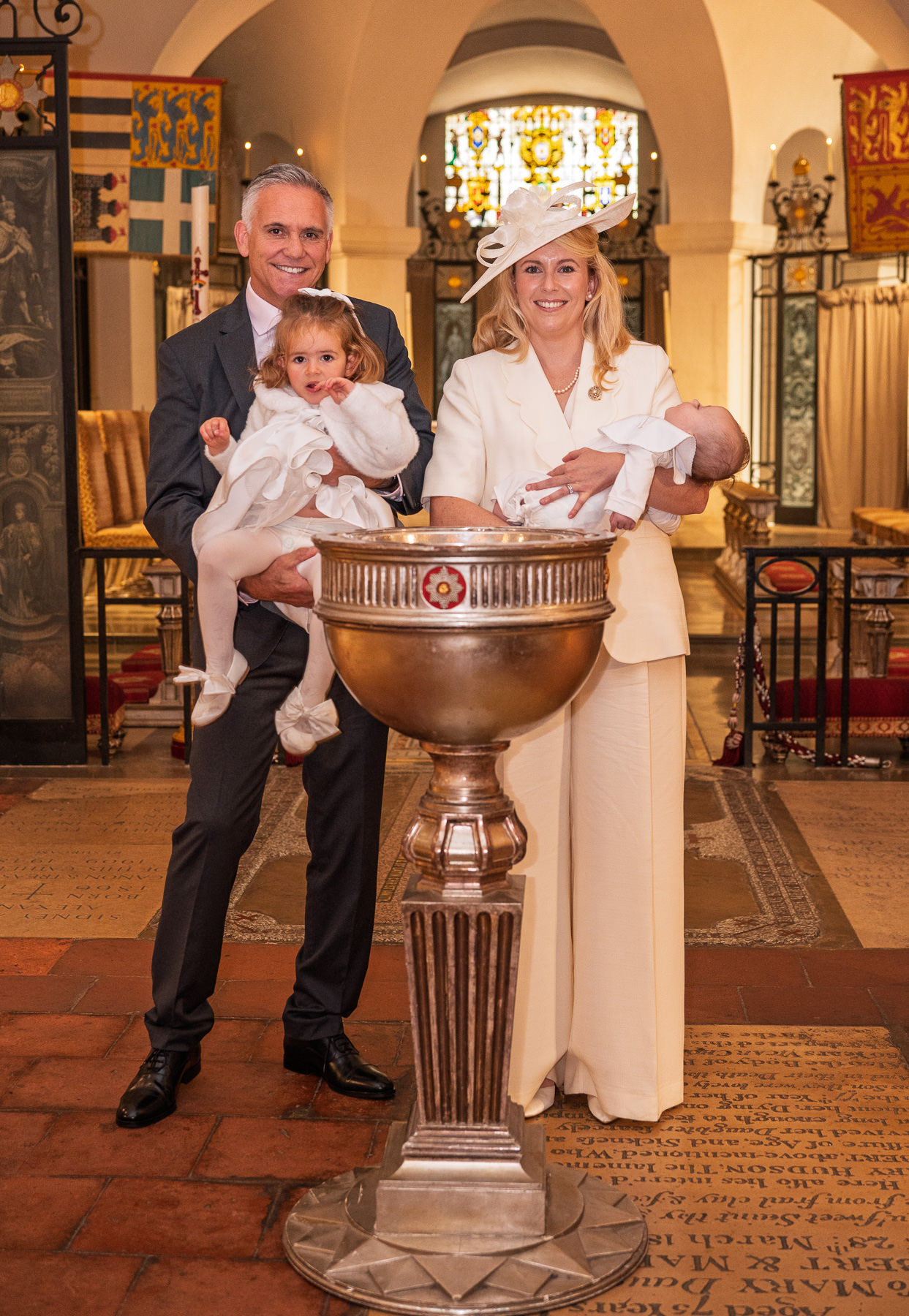 Jane and Jason with their two children at the font in the OBE Chapel, St Paul's Cathedral