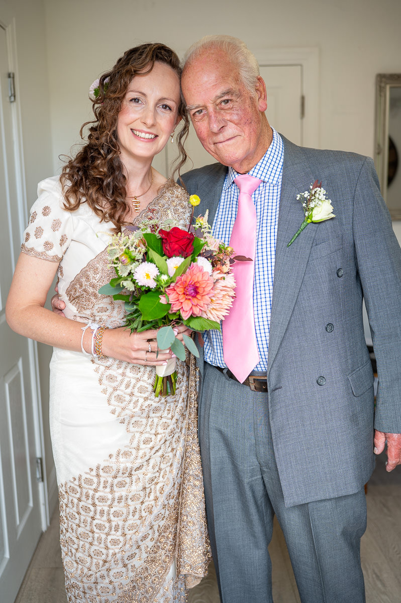 The bride with her father before the ceremony