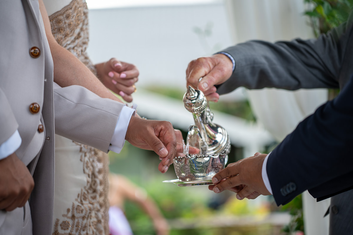 Water poured over the couple's joined hands during the Poruwa ceremony