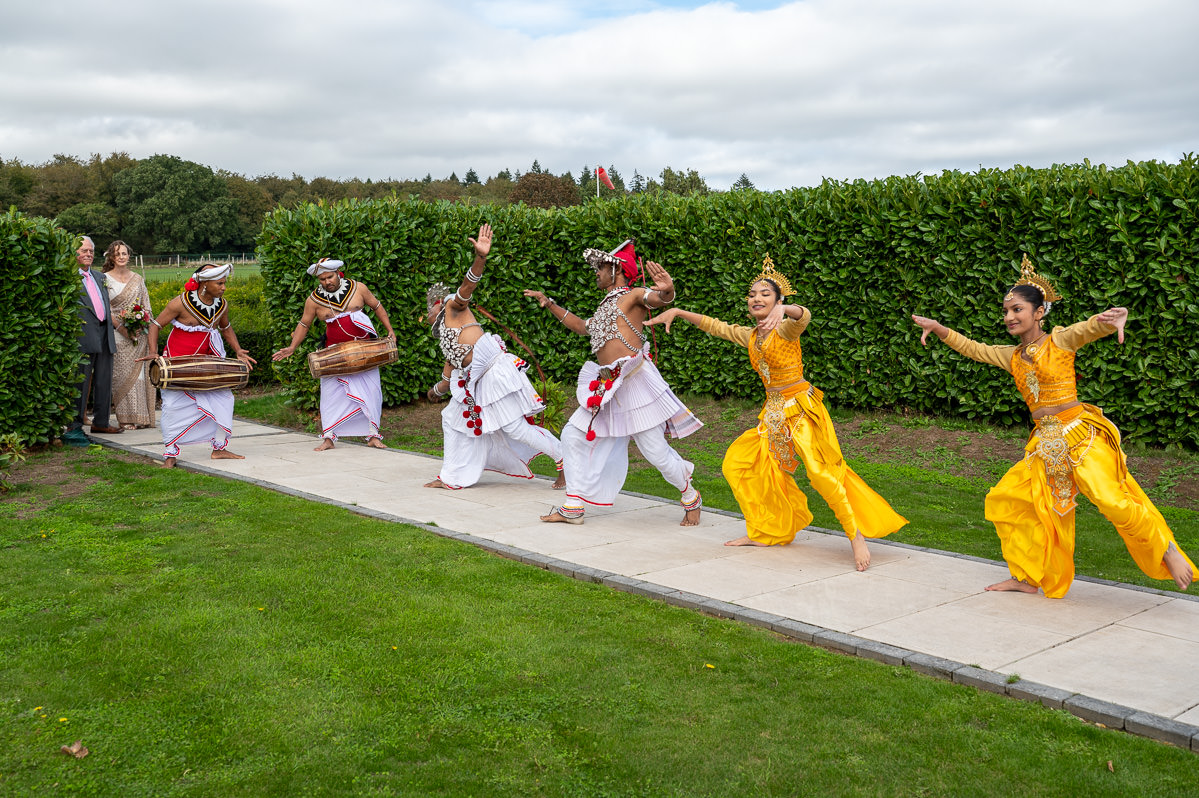 Kandyan dancers performing on the lawn at Selden Barns