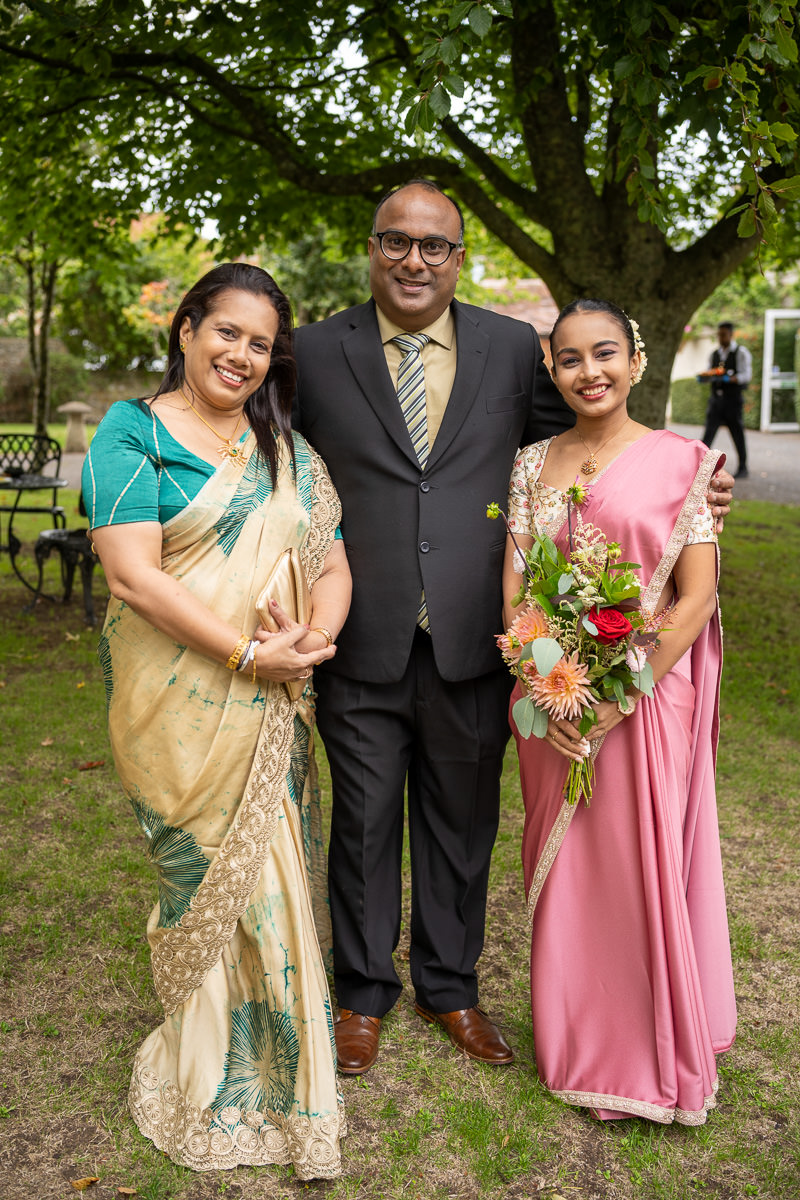 A family portrait under the trees at Selden Barns