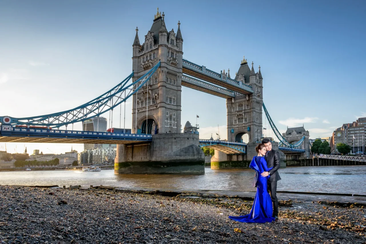 Pre wedding couple on the Thames foreshore below Tower Bridge at sunset
