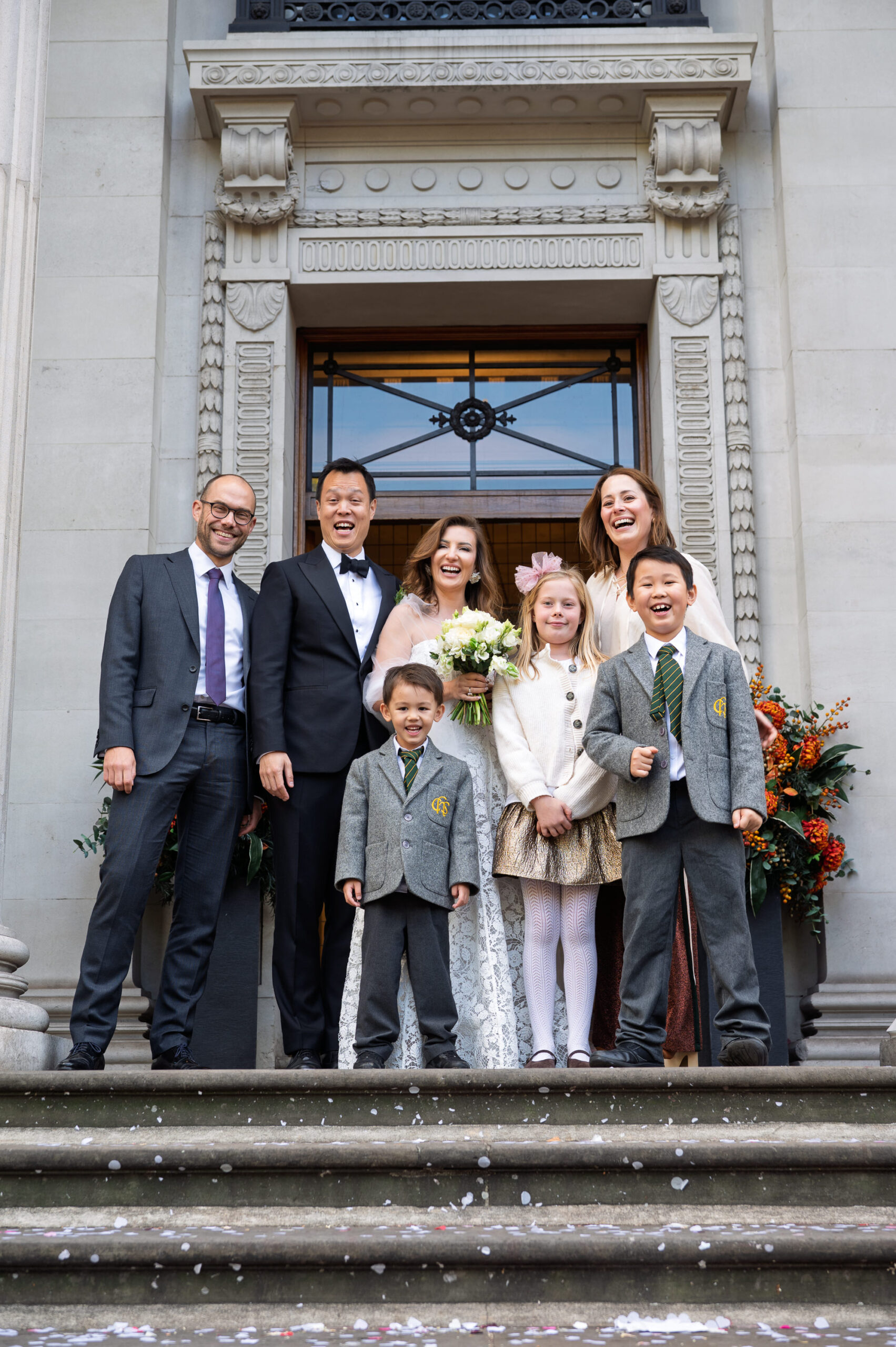 Nicoleta and Alistair with the children on the front steps of Old Marylebone Town Hall