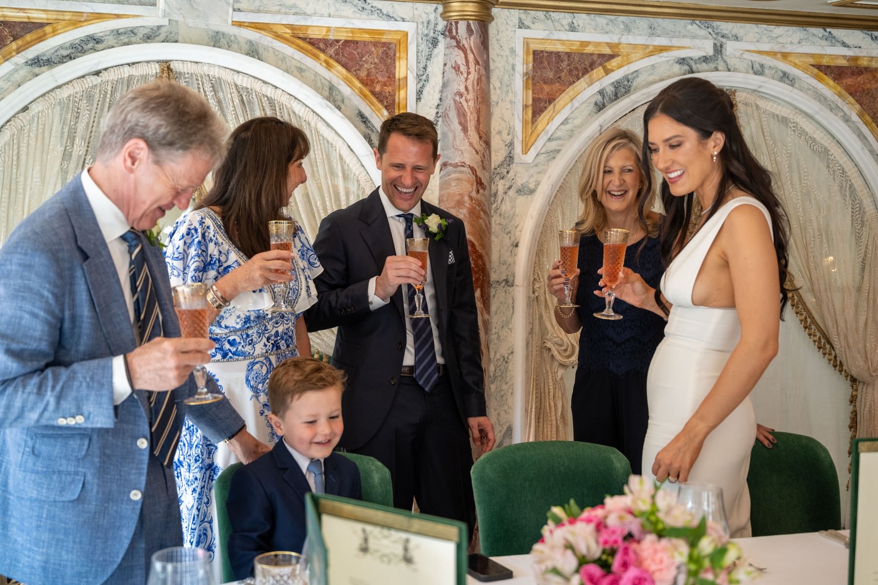 Sam, Matt and family raising a champagne toast in the private dining room at Bacchanalia