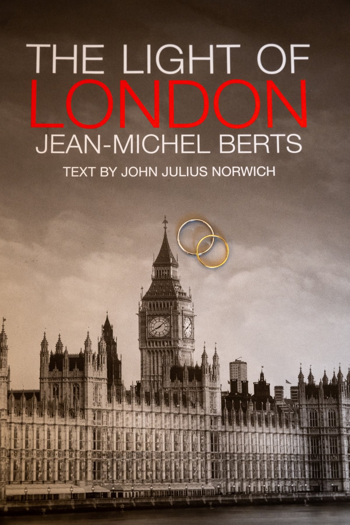 Wedding rings resting on the cover of a book of London photographs, with Big Ben on the cover